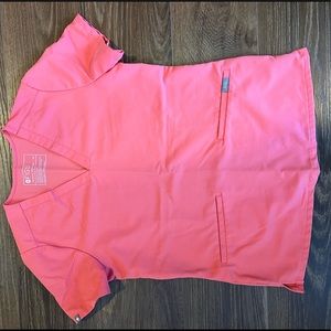 FIGS Casma three pocket scrub top in hot coral